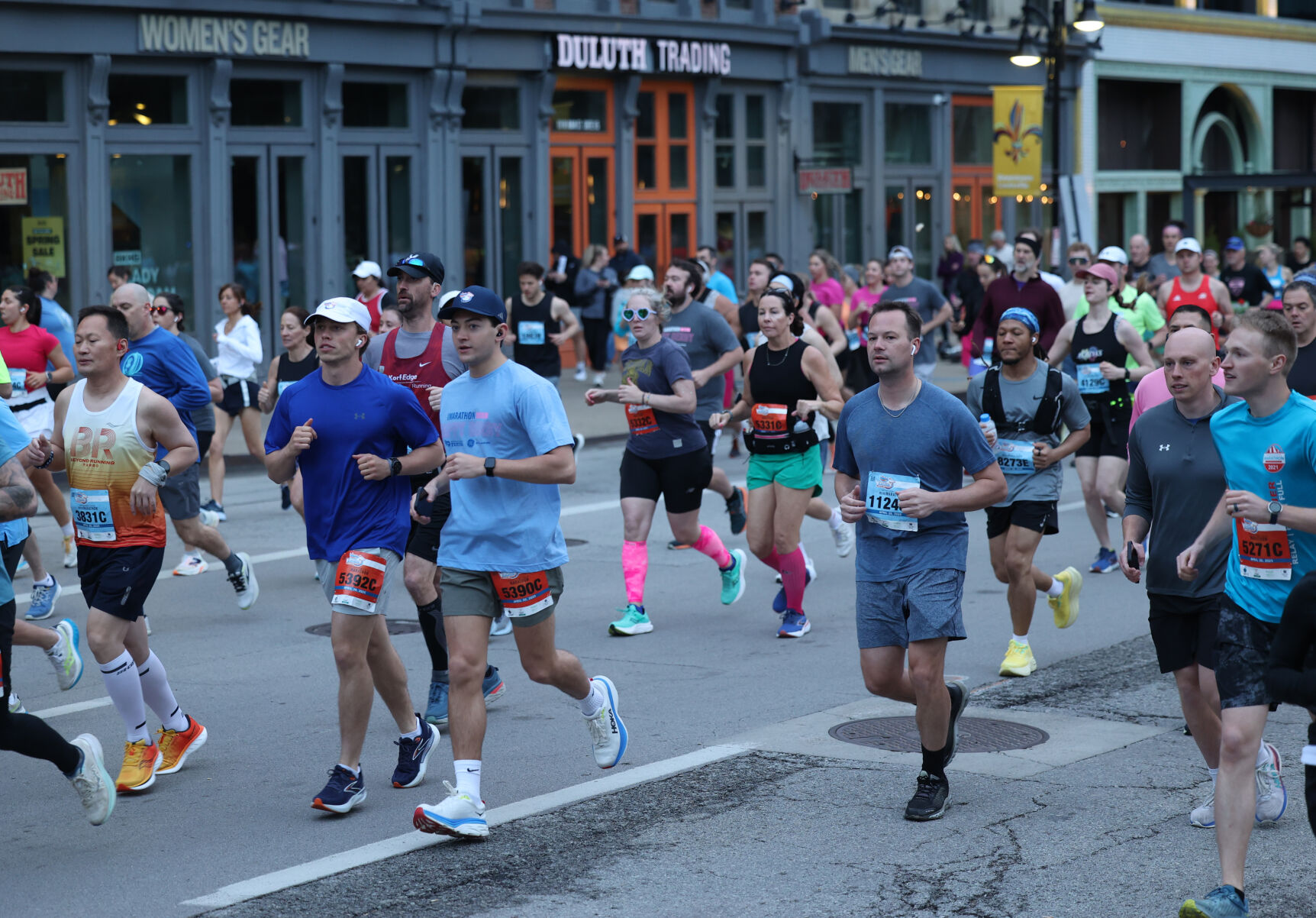 People go by Whiskey Row during Marathon.JPG